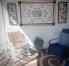 SCREEENED LANAI WITH A PADDED WOODEN ROCKER &  TWO PADDED RECLINER CHAIRS