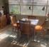 Extended living space, game/dinning table, new wooden floors and area rug.