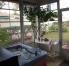 Screened back porch.  Privacy hedge and seldom used golf cart path gives privacy.