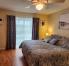 2nd bedroom queen bed with golf view