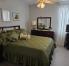 Bedroom with queen size bed and full closet. Room shares a Jack and Jill bathroom.