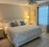 Primary Bedroom - King bed, TV, Armoire, 2 night stands, lamps