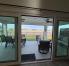 sliding door from living/dining room to lanai, shows view of Preserve.