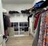 large walk-in master closet with organizer