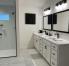 Bathroom #1 - Primary Bathroom - Walk-In Shower with Grab Bar; Dual Vanities; Walk-In Closet